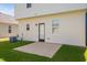 A quaint patio sits off the rear of the home surrounded by a lush lawn at 147 Sunfish St, Smithfield, NC 27577