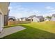 A sprawling backyard with manicured lawn, and a concrete patio perfect for entertaining at 147 Sunfish St, Smithfield, NC 27577