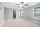 Bright bedroom featuring carpet, closet and a ceiling fan at 147 Sunfish St, Smithfield, NC 27577