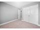 Neutral bedroom with carpet, and a double door closet offers ample storage space at 147 Sunfish St, Smithfield, NC 27577