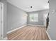 Open-concept area featuring a dining space and modern kitchen with gray cabinets and stainless steel appliances at 147 Sunfish St, Smithfield, NC 27577