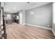 Open-concept area featuring a dining space and modern kitchen with gray cabinets and stainless steel appliances at 147 Sunfish St, Smithfield, NC 27577