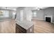 Spacious open-concept layout connecting the kitchen with the living area, complete with a fireplace at 147 Sunfish St, Smithfield, NC 27577