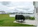 Inviting backyard with a patio, outdoor seating, and a grill perfect for gatherings at 1476 Burgundy Bluff Ln, Zebulon, NC 27597