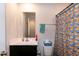 Bathroom featuring vanity with mirror and toilet with colorful banana-themed shower curtain at 1476 Burgundy Bluff Ln, Zebulon, NC 27597