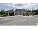 Community building boasts parking, landscaping, and architectural details, enhancing neighborhood appeal at 1476 Burgundy Bluff Ln, Zebulon, NC 27597