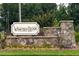 Weaver's Ridge entrance sign is beautifully landscaped with stone accents, welcoming residents and visitors at 1476 Burgundy Bluff Ln, Zebulon, NC 27597