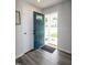 Welcoming entryway with a peek into the neighborhood through the open front door at 1476 Burgundy Bluff Ln, Zebulon, NC 27597
