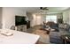Open-concept kitchen with large island, stainless appliances, and a seamless view to the living area, perfect for entertaining at 1476 Burgundy Bluff Ln, Zebulon, NC 27597