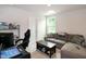 Relaxing living room featuring comfortable seating, natural light, and ample space for entertainment at 1476 Burgundy Bluff Ln, Zebulon, NC 27597