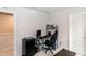 Relaxing entertainment room featuring comfortable gaming chair and access to the hall at 1476 Burgundy Bluff Ln, Zebulon, NC 27597