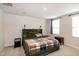 Spacious bedroom with neutral carpet, a king size bed, and natural light from the windows at 1476 Burgundy Bluff Ln, Zebulon, NC 27597