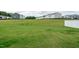 Beautiful view of new construction homes over looking a vast lawn and a secure vinyl fence at 1476 Burgundy Bluff Ln, Zebulon, NC 27597