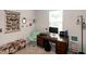 Charming office space featuring a wooden desk, unique butterfly artwork, and comfortable seating at 1476 Burgundy Bluff Ln, Zebulon, NC 27597