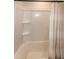 Bathroom shower featuring a shower head and curtain at 1476 Burgundy Bluff Ln, Zebulon, NC 27597