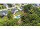 An aerial view of the property and pool surrounded by mature trees at 149 Great Oak Dr, Garner, NC 27529