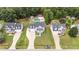 Aerial view of a residential neighborhood showcasing the house and backyard pool at 149 Great Oak Dr, Garner, NC 27529