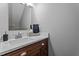 Bathroom featuring wood vanity with light countertops and modern fixtures at 149 Great Oak Dr, Garner, NC 27529