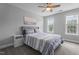 Comfortable bedroom with blue striped bed and coordinated decor, with lots of natural light at 149 Great Oak Dr, Garner, NC 27529