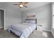 Comfortable bedroom with blue striped bed and coordinated decor, with lots of natural light at 149 Great Oak Dr, Garner, NC 27529