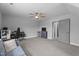 Neutral bedroom features plush carpeting, recessed lighting, and a modern ceiling fan at 149 Great Oak Dr, Garner, NC 27529