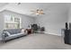 Bonus room with a ceiling fan, carpet floor, desk and game setup, and a couch at 149 Great Oak Dr, Garner, NC 27529