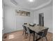 Bright dining room with white walls, tray ceiling, and wood floors at 149 Great Oak Dr, Garner, NC 27529