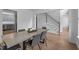 A dining room with stairs, grey chairs, a table, and neutral décor at 149 Great Oak Dr, Garner, NC 27529