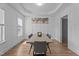Dining room with white walls and a tray ceiling, features a large table with seating at 149 Great Oak Dr, Garner, NC 27529