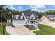 Beautiful two-story home with dormer windows, shutters, a front porch, and a two-car garage at 149 Great Oak Dr, Garner, NC 27529