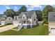 Lovely two-story home with a two-car garage, a welcoming porch, and a green lawn at 149 Great Oak Dr, Garner, NC 27529