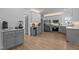Spacious kitchen featuring stainless steel appliances and sleek gray and white cabinetry at 149 Great Oak Dr, Garner, NC 27529