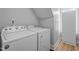 Laundry room with a white Whirlpool washer and dryer at 149 Great Oak Dr, Garner, NC 27529