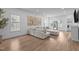 Comfortable living room with large windows, hardwood floors and stylish furnishings at 149 Great Oak Dr, Garner, NC 27529