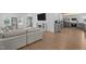 Open living room boasts wood floors, a fireplace, and seamless flow into the kitchen at 149 Great Oak Dr, Garner, NC 27529
