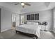 Spacious main bedroom featuring a tray ceiling, plush carpet, and ample natural light at 149 Great Oak Dr, Garner, NC 27529