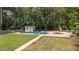 Backyard features an in-ground swimming pool, storage shed, and lounge area, perfect for outdoor fun at 149 Great Oak Dr, Garner, NC 27529