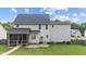Exterior view of a home with a screened porch, manicured lawn, and lush greenery at 149 Great Oak Dr, Garner, NC 27529