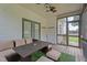 Inviting screened porch with wood floors, comfortable seating, and ample natural light at 149 Great Oak Dr, Garner, NC 27529