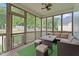 Covered porch features wood floors, multiple windows, and outdoor seating at 149 Great Oak Dr, Garner, NC 27529