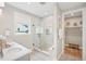 Modern bathroom with glass-enclosed shower, patterned tile flooring, and a storage closet at 160 Serene Xing, Fuquay Varina, NC 27526