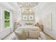 Elegant bedroom featuring ample natural light, tray ceilings, and soft decor at 160 Serene Xing, Fuquay Varina, NC 27526