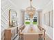 Formal dining room with chandelier, accent wall, and plenty of seating at 160 Serene Xing, Fuquay Varina, NC 27526
