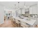 Bright kitchen with white cabinets, quartz countertops, oversized island, and pendant lighting at 160 Serene Xing, Fuquay Varina, NC 27526