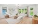 Cozy living room with large windows offering natural light and a view of the outdoors at 160 Serene Xing, Fuquay Varina, NC 27526
