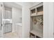 Mudroom with built in shelving, storage, and laundry machines at 160 Serene Xing, Fuquay Varina, NC 27526