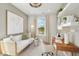 Cozy office with a daybed, desk, white accents and natural light at 160 Serene Xing, Fuquay Varina, NC 27526