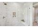 Modern shower featuring mosaic tile, a glass enclosure, and built-in niche, creating a luxurious spa-like experience at 160 Serene Xing, Fuquay Varina, NC 27526