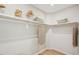 Spacious walk-in closet with wooden shelves and rods, providing ample storage and organization at 160 Serene Xing, Fuquay Varina, NC 27526