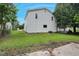 View of the home's fenced yard with mature trees at 163 W Lillington St, Angier, NC 27501